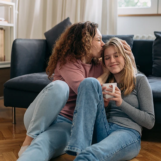 Mom and Daughter drinking Coffee.