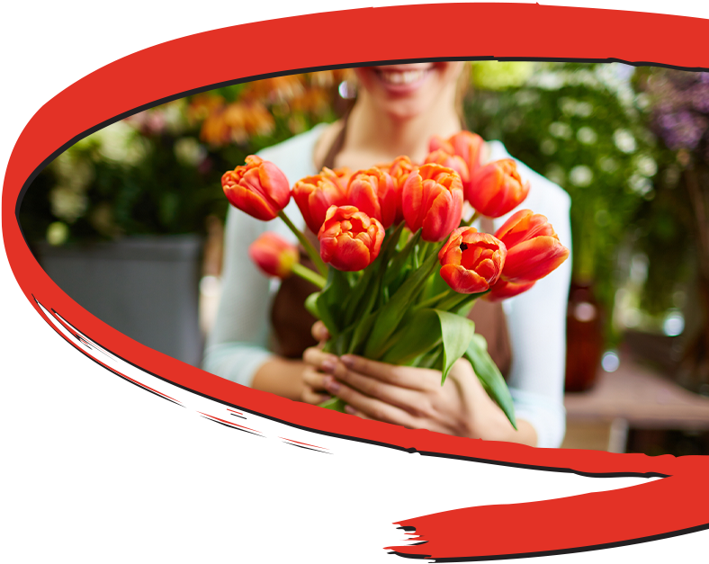 A women holding a boquet of flowers.