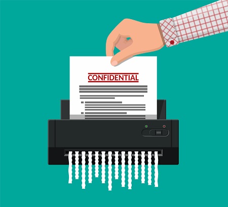 Confidential paper being shredded.