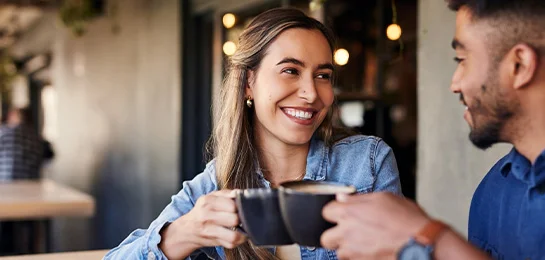 Two people drinking coffee.