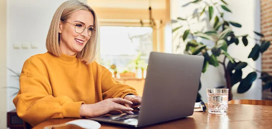 Women contacting her bank on her computer.