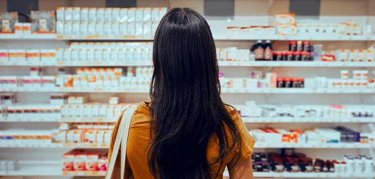 A women checking out at the pharmacy.