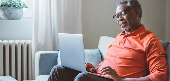 Older man banking online.