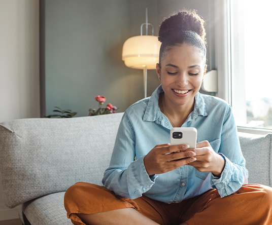 Lady checking her balance with mobile banking.