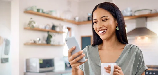 Women doing her banking on her phone.