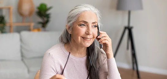 Women doing her banking over the telephone.