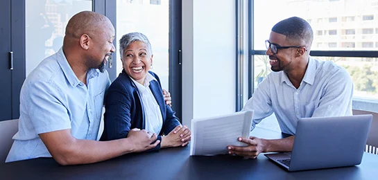An investment advisor going over a couples portfolio.